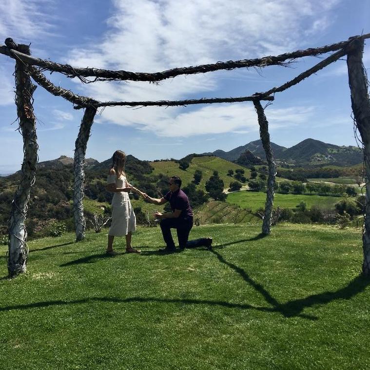 Gisbert practicing how to propose to Lety during a wine tasting tour.
