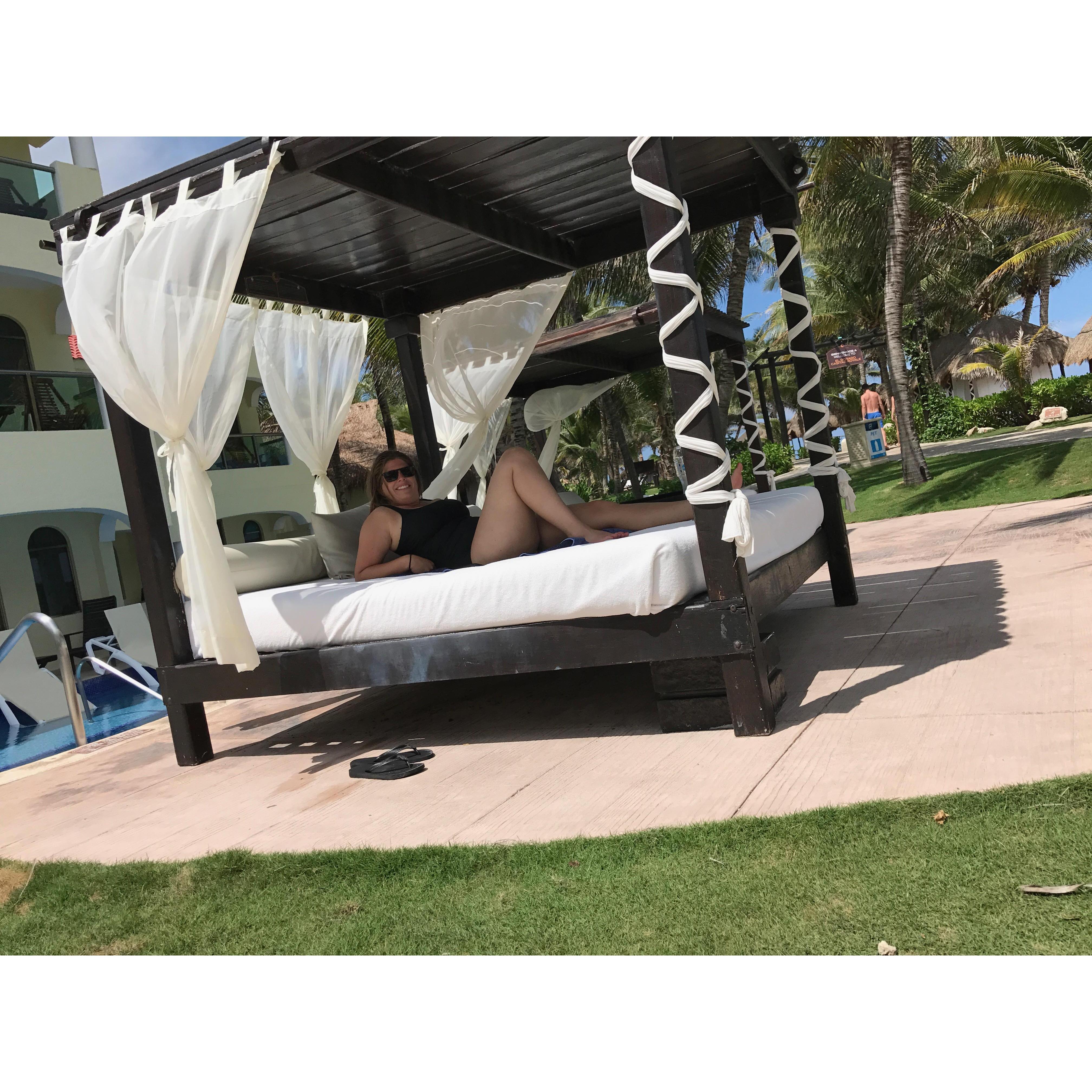 Lounging by the pool - they have daybeds and lounge chairs
