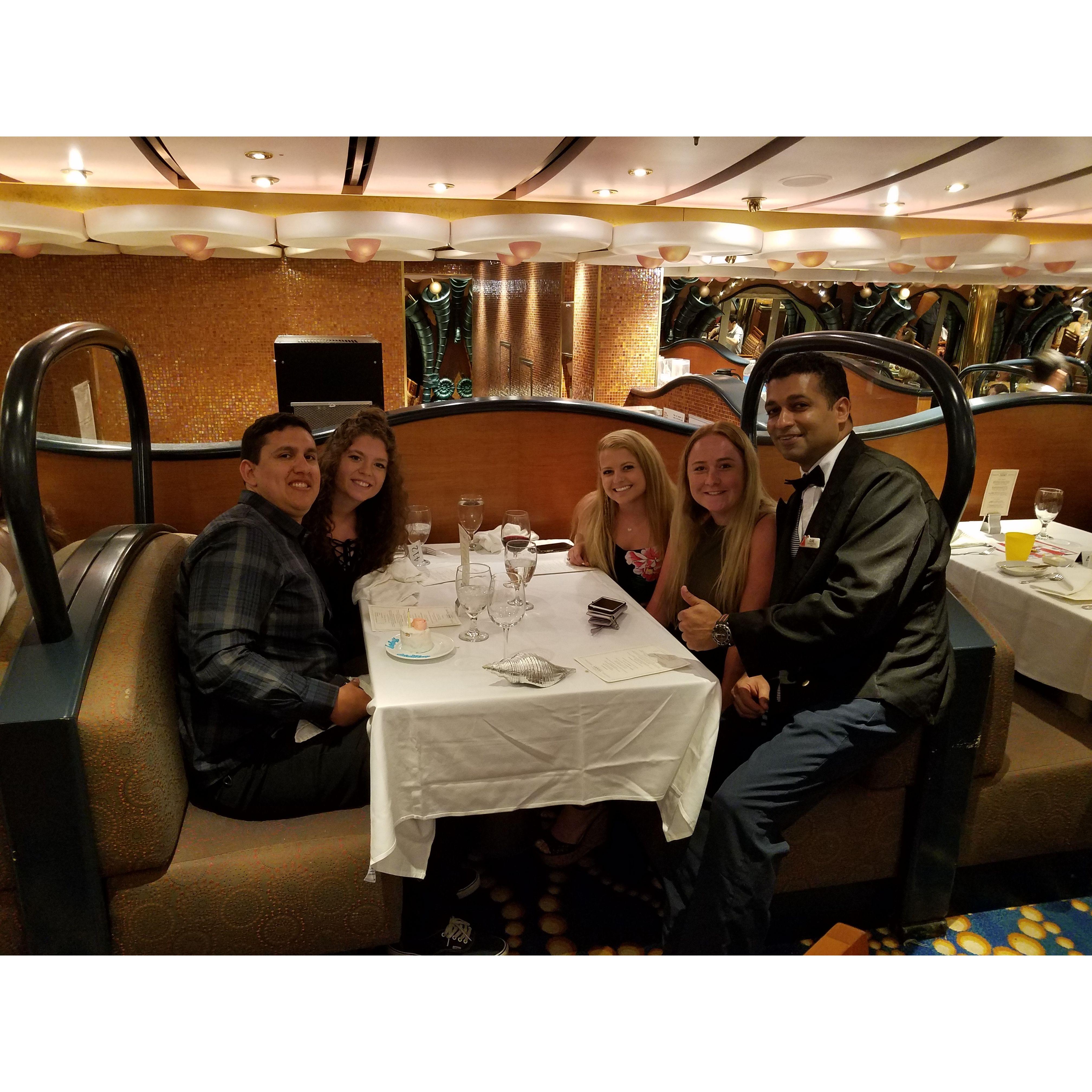 Us on the cruise with our favorite server, Clive