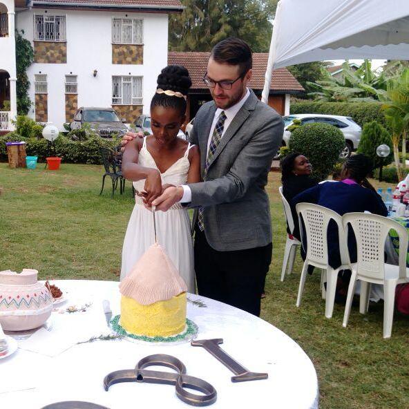 Cake: Cutting our farewell cakes at the ceremony in Nairobi. Two cakes were present.  On  the right , the one currently being cut was a traditional home; hut and the one on the left was a cooking pot.