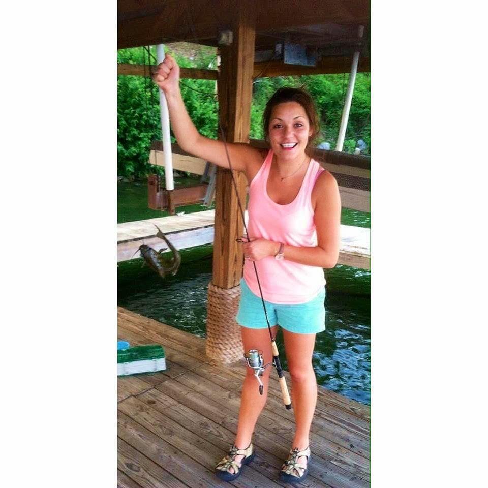 This is the first time Lundy ever went fishing. Don't judge the size of the fish! She was excited to catch one on the family dock.
