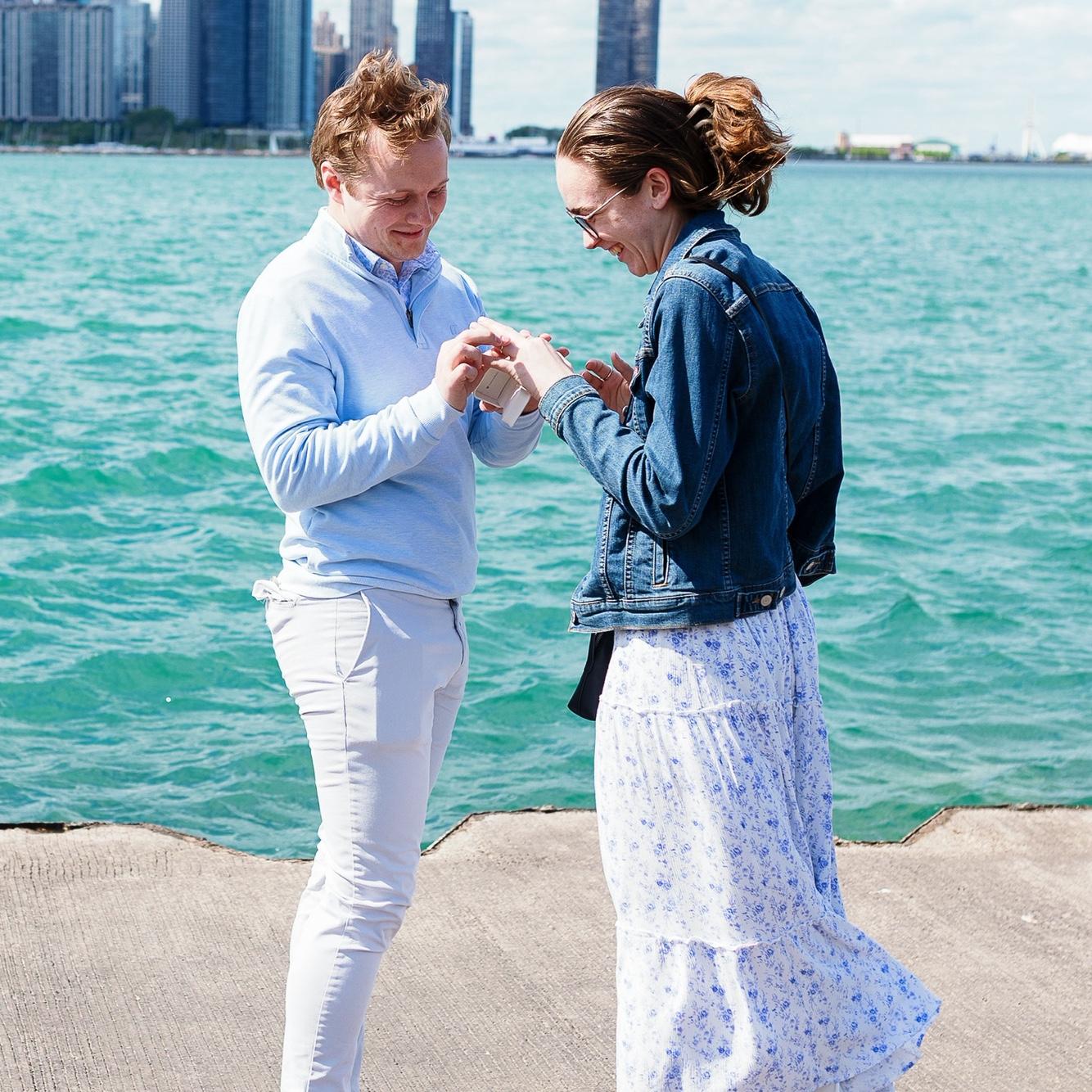 One of the beautiful engagement photos Sean's Aunt Tracy took of the couple after the proposal. This one's called "Put that ring on!"