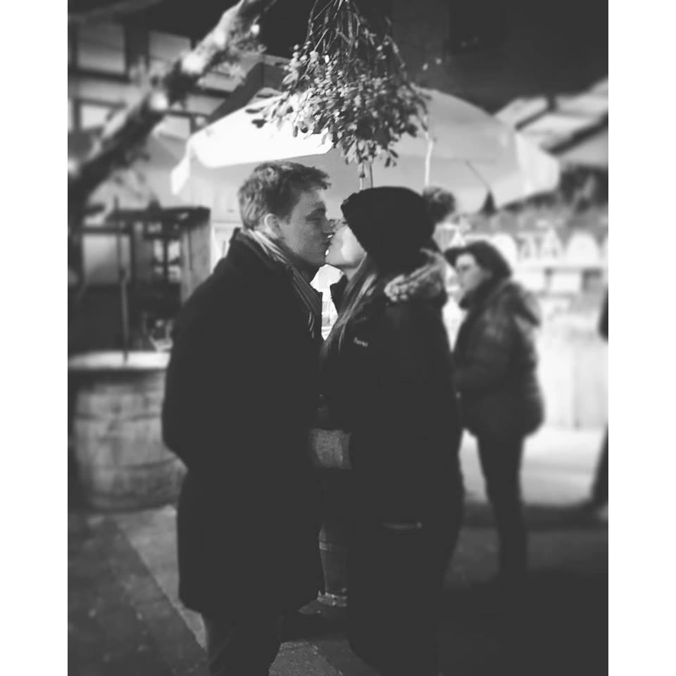 Todd and Savanah (Brother of the Bride, and Wedding Photographer) Sharing a kiss under mistletoe at the Kaiserslautern Christmas market 2018.