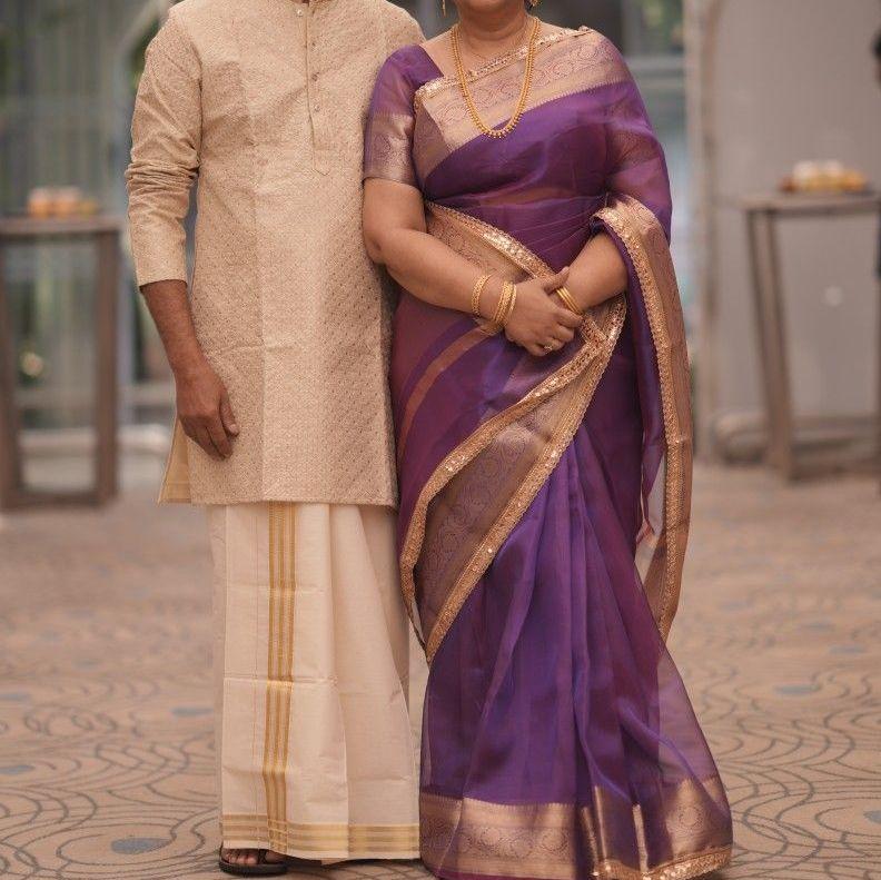 Traditional wedding guest attire - Kurta + veshti for men, silk saree for women