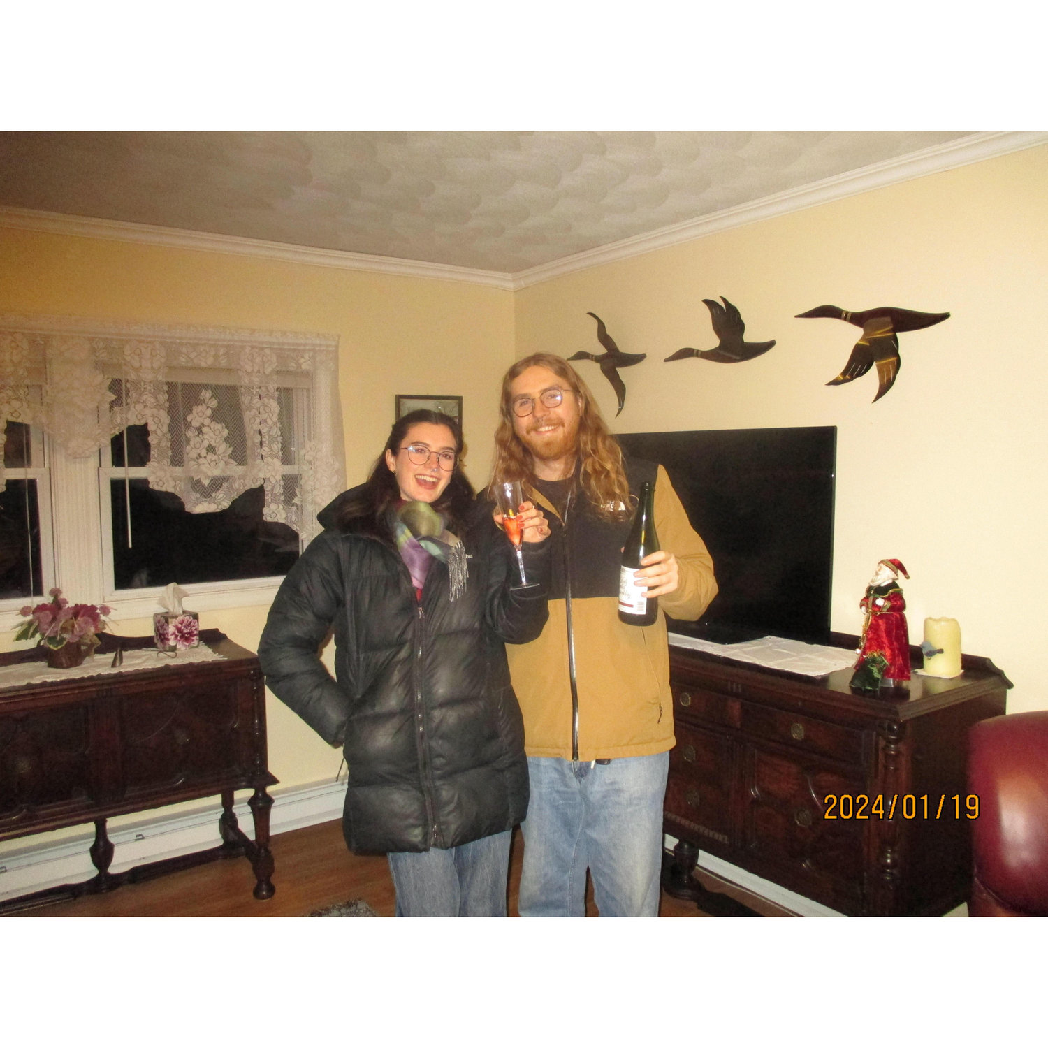 Toasting (and freezing cold) after closing on our house, which was at the time uninsulated. It was very cold, but we were happy anyway-- January 2024.
