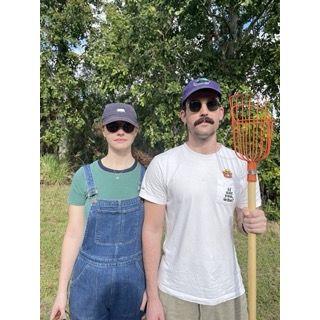 Florida people doing Florida things (picking oranges).