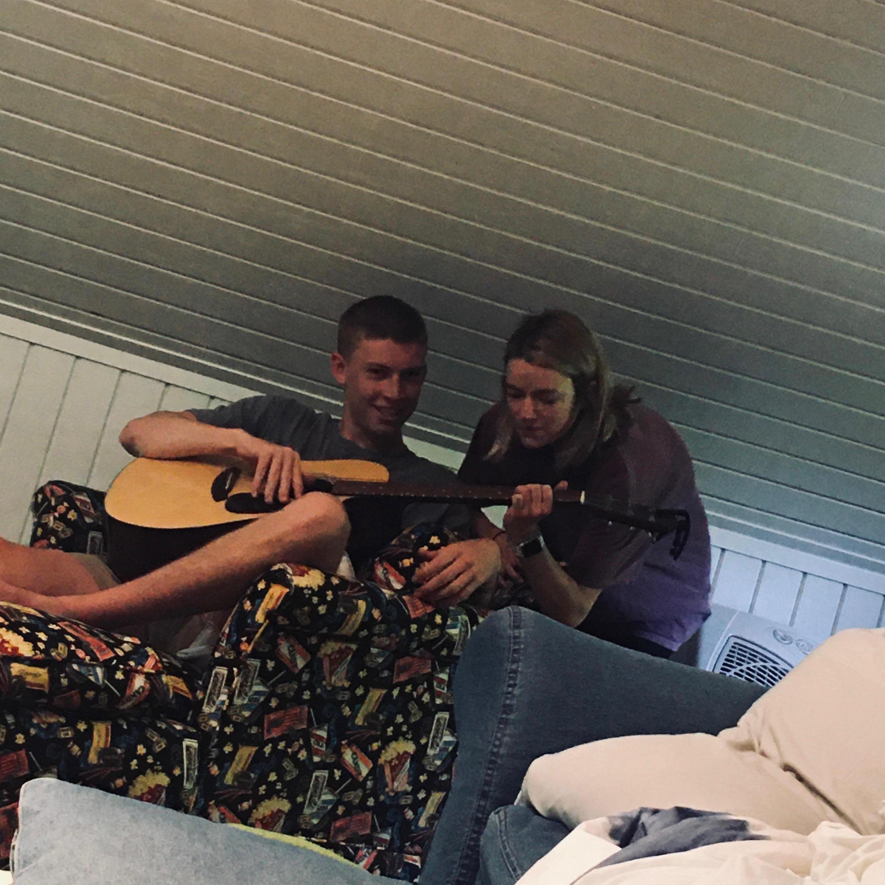 Lily only knows one song on guitar but she was oddly quick to step in and teach me. Despite the fact that the person taking the picture has been playing for years.