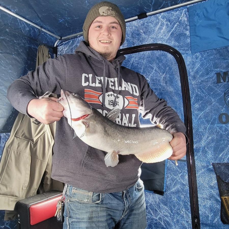 Branden going ice fishing with my dad
