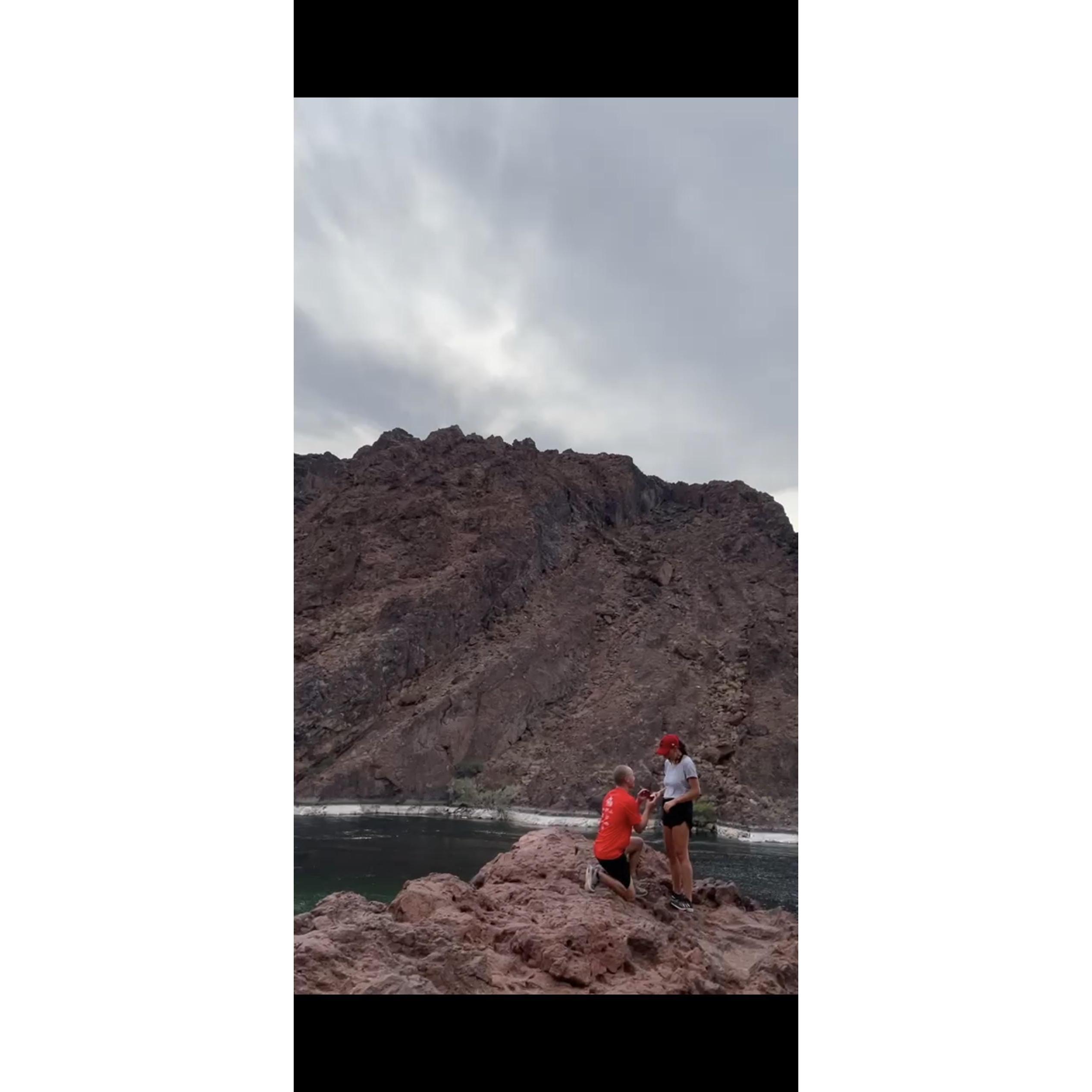 Pat proposing to Sam in front of the Colorado River.