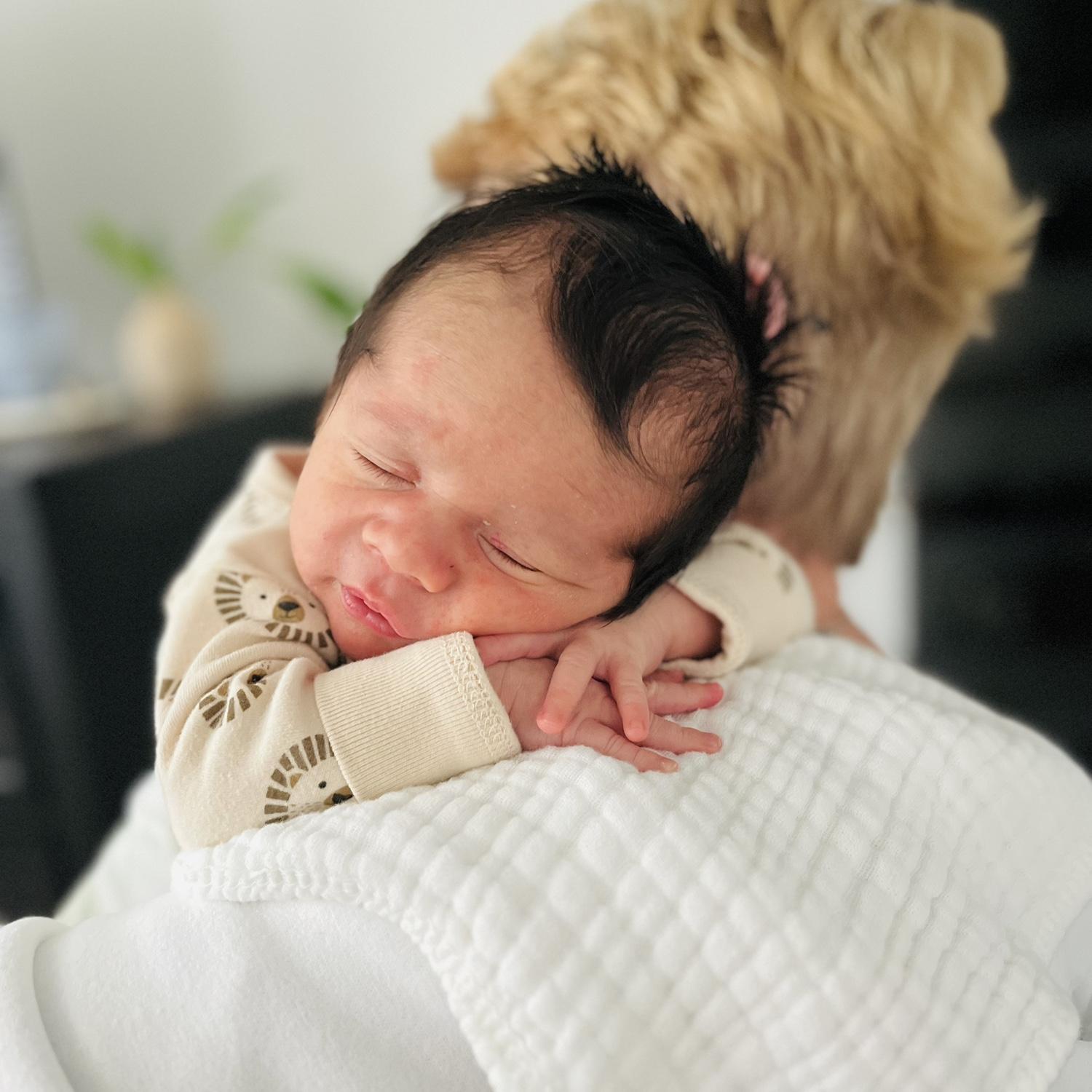 Snuggling on grandma's shoulder!