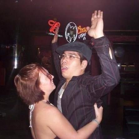 We were just friends in this picture from 2008. Our friend took it when we weren't paying attention.  Not sure but I think I was giving him a back rub.