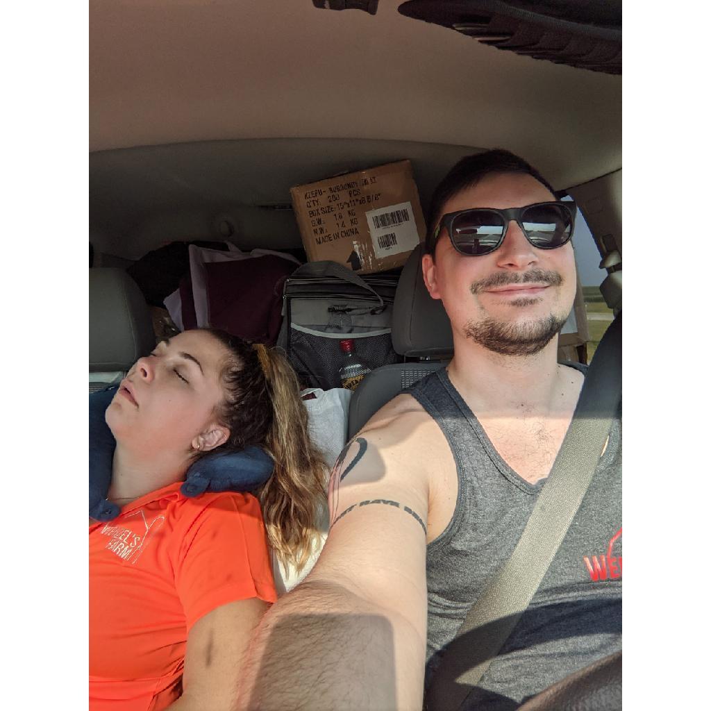 After only 1 month of dating, Matthew joined Karrah on a work trip passing out meat sticks across Iowa. During a car ride, Karrah knocked out and Matthew took this photo–they didn't know she had mono!
