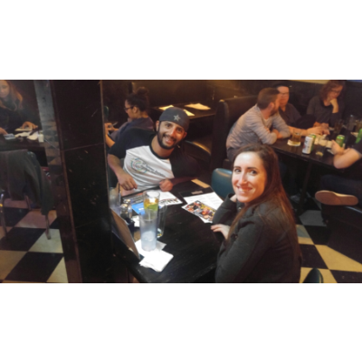 Our first photo together. It was our second date and we played trivia. They took pictures of each team.