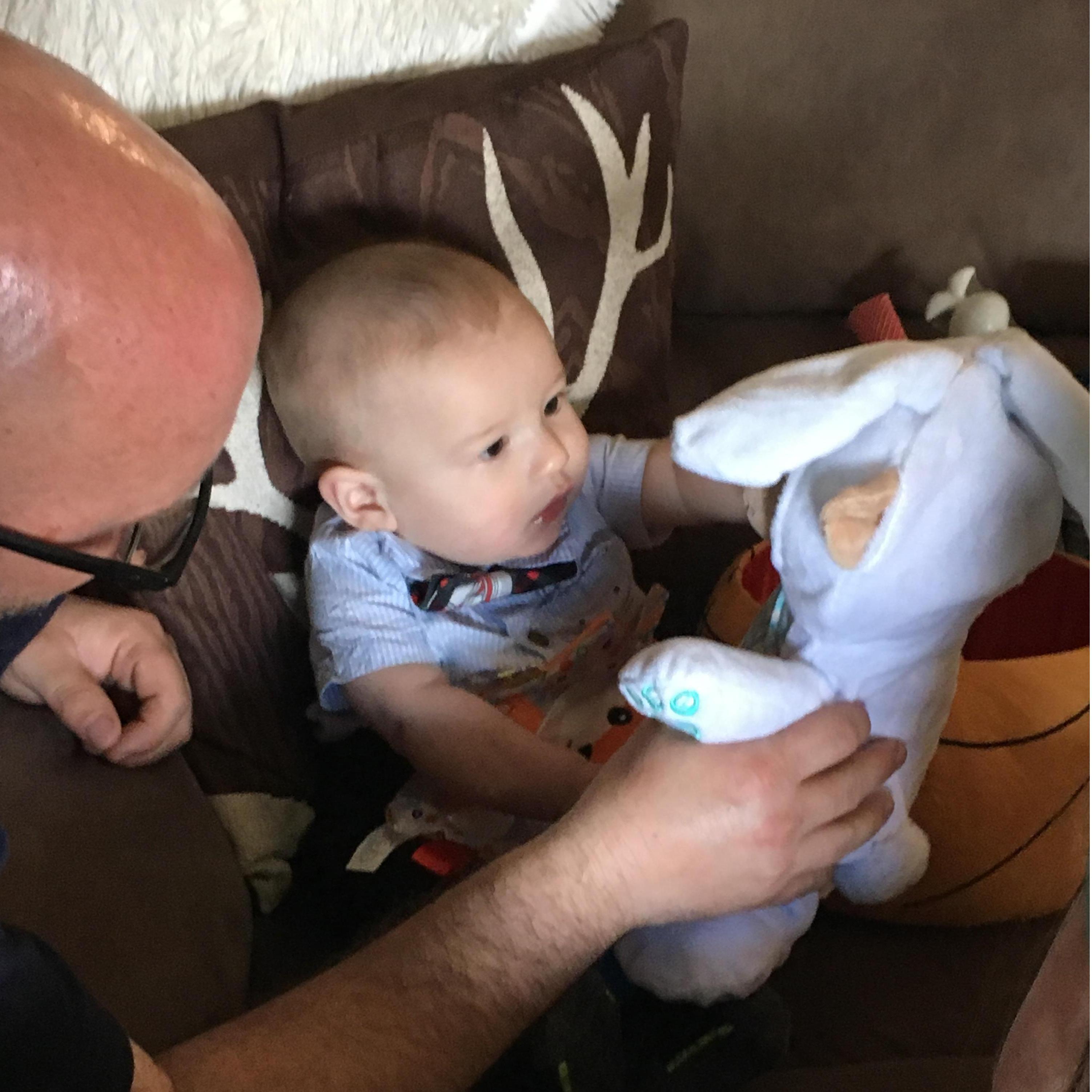 Our nephew Benjamin opening his Easter toys.