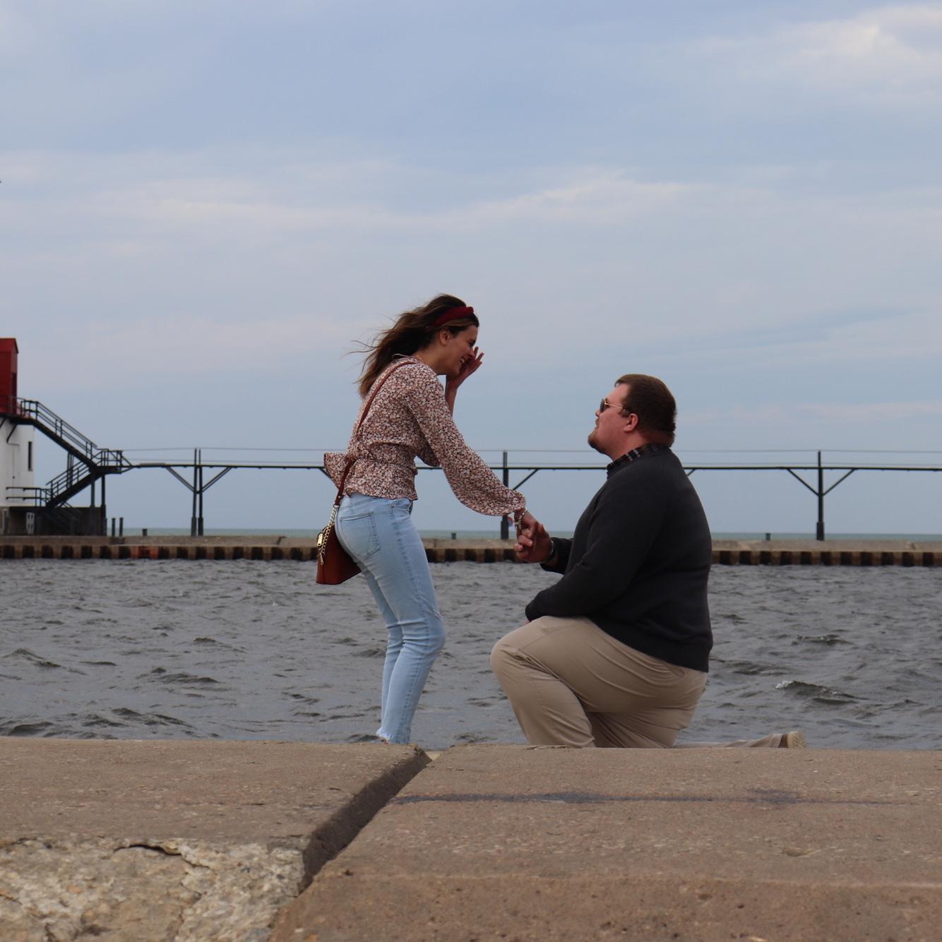 Matt proposed to Bela at the lighthouse in St. Joseph MI. 

Fun fact: Bela had no idea that Matt’s friend was there taking pictures.