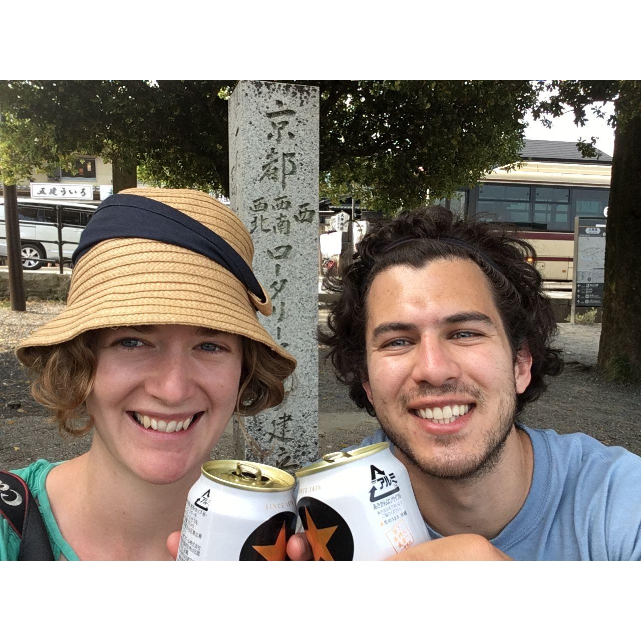 Enjoying a Sapporo on the banks of the river in Kyoto