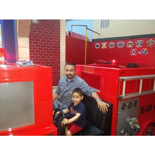 This boy loves his firetrucks!