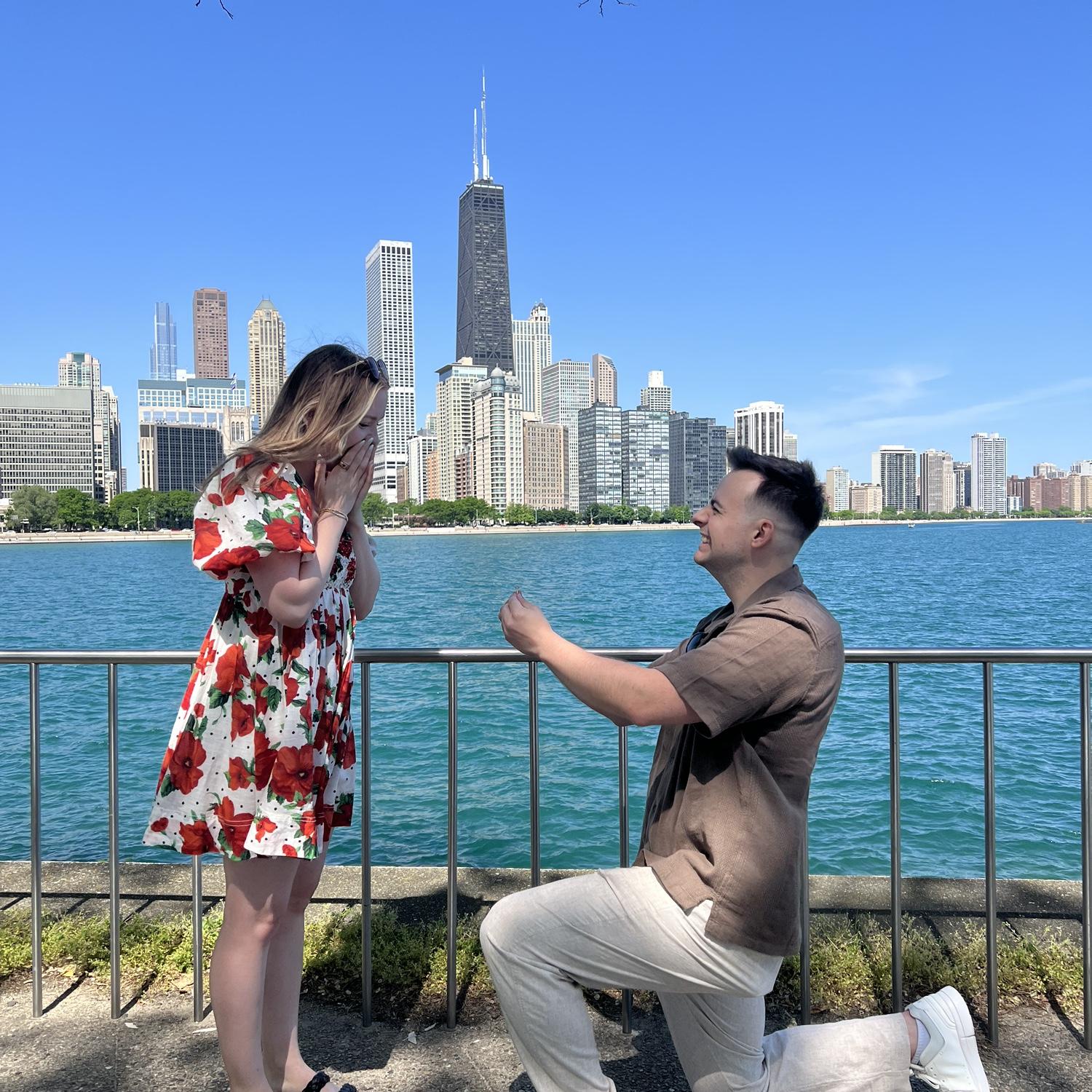Sean proposed on the lake front in Chicago! He was so excited he couldn't sleep the night before and practiced nailing the "proposal kneel"