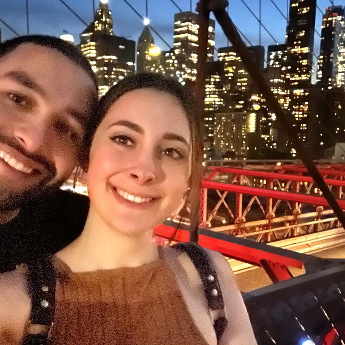 Walking the Brooklyn Bridge together after eating some tacos