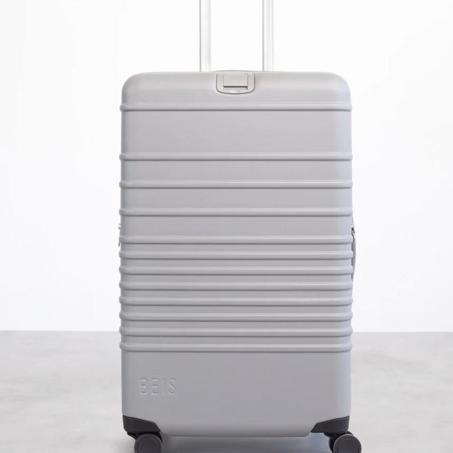 The 26" Check-In Roller (one beige, one gray)