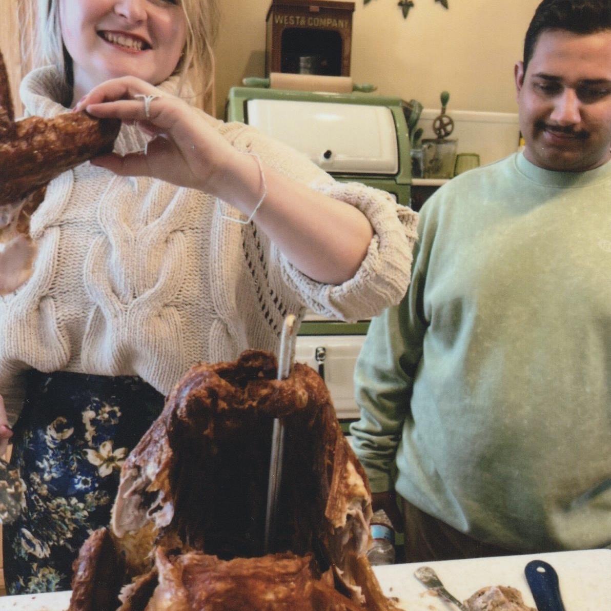 Molly carving the turkey Shawn deep fried before the proposal
