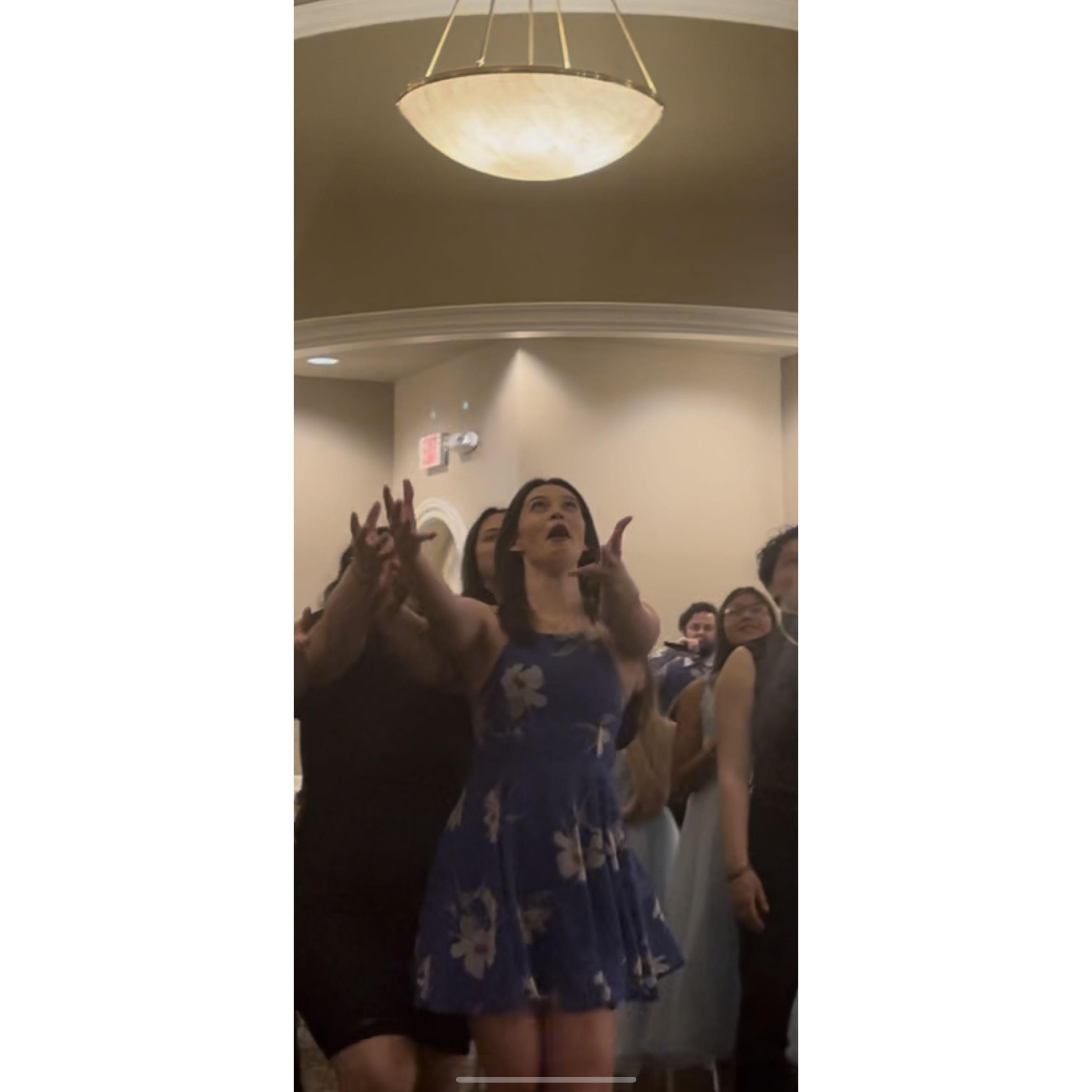 Shannon DESPERATELY trying to catch the bouquet at Jasons best friends, Chris and Christina's, wedding. She was not successful (this time)