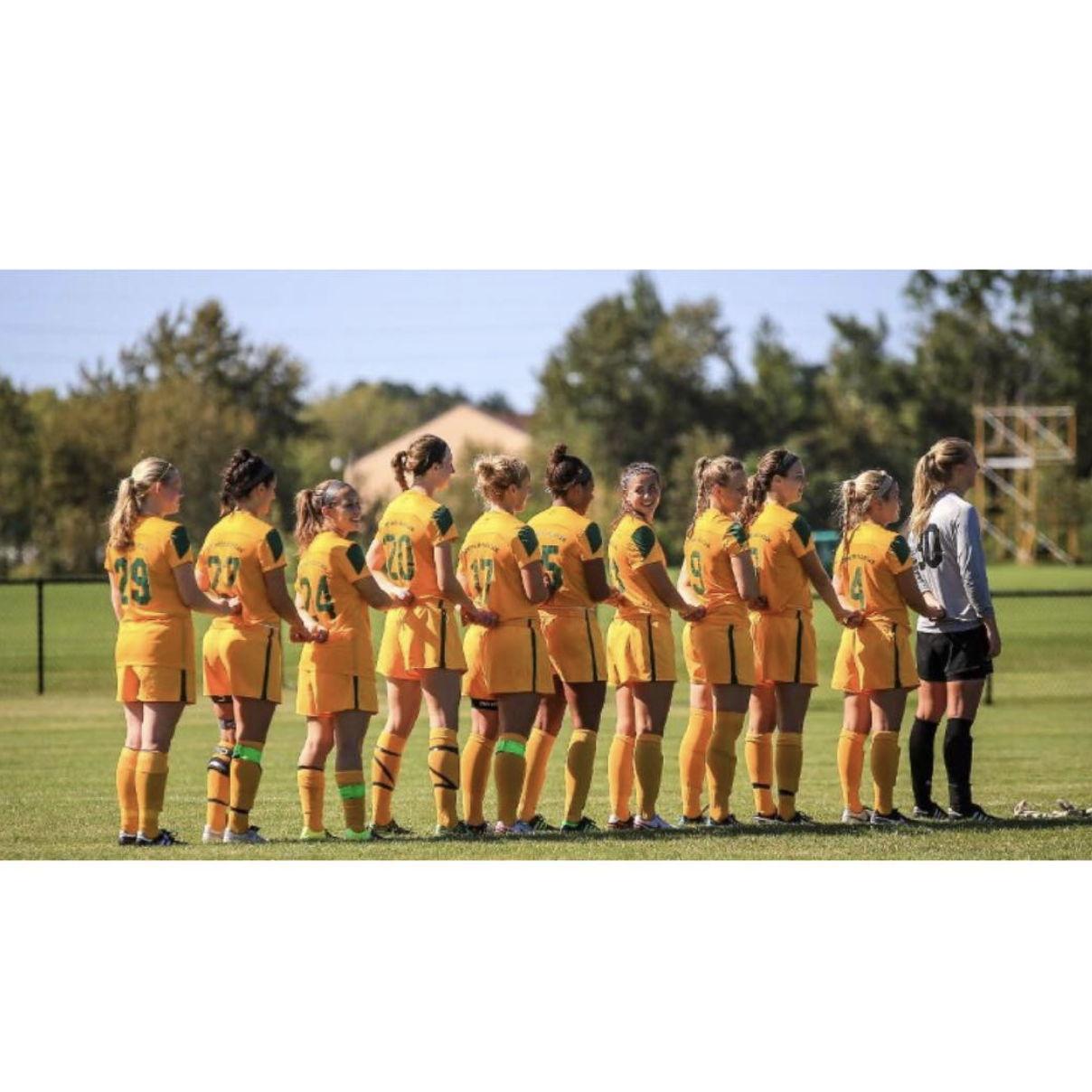 One of many pre-game, national anthem lineups while playing soccer together at NMU.