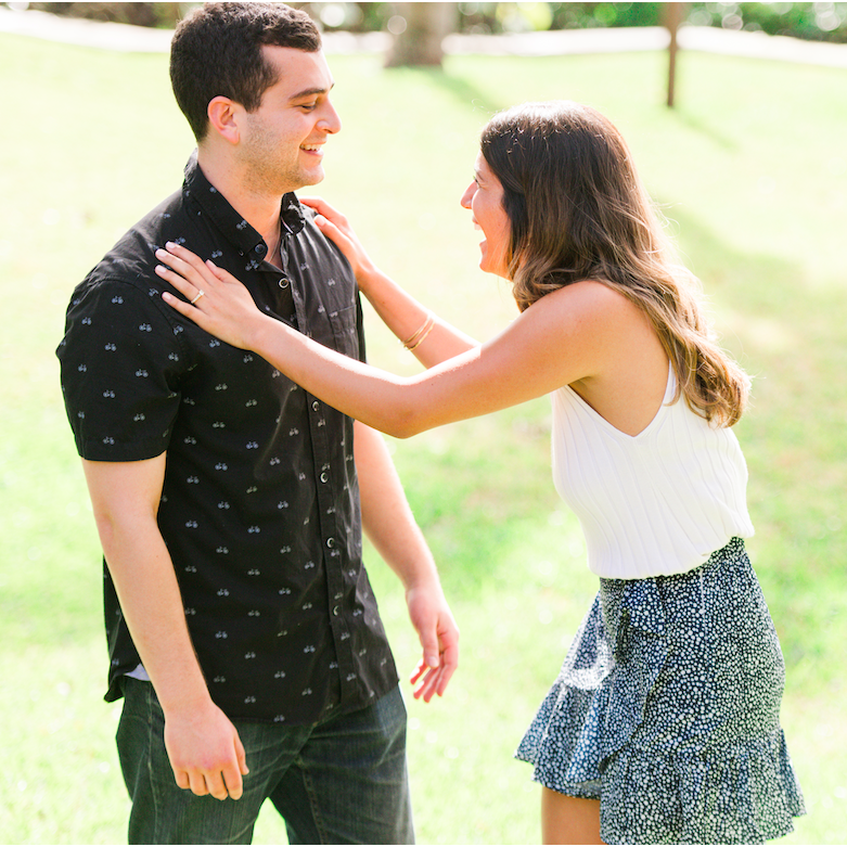Pushing Matt away in disbelief after he got down on one knee!