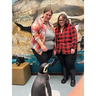 Christina surprised Carrie with a penguin meeting for her graduation from nursing school. Penguins are both Carrie and Christina's favorite animal.