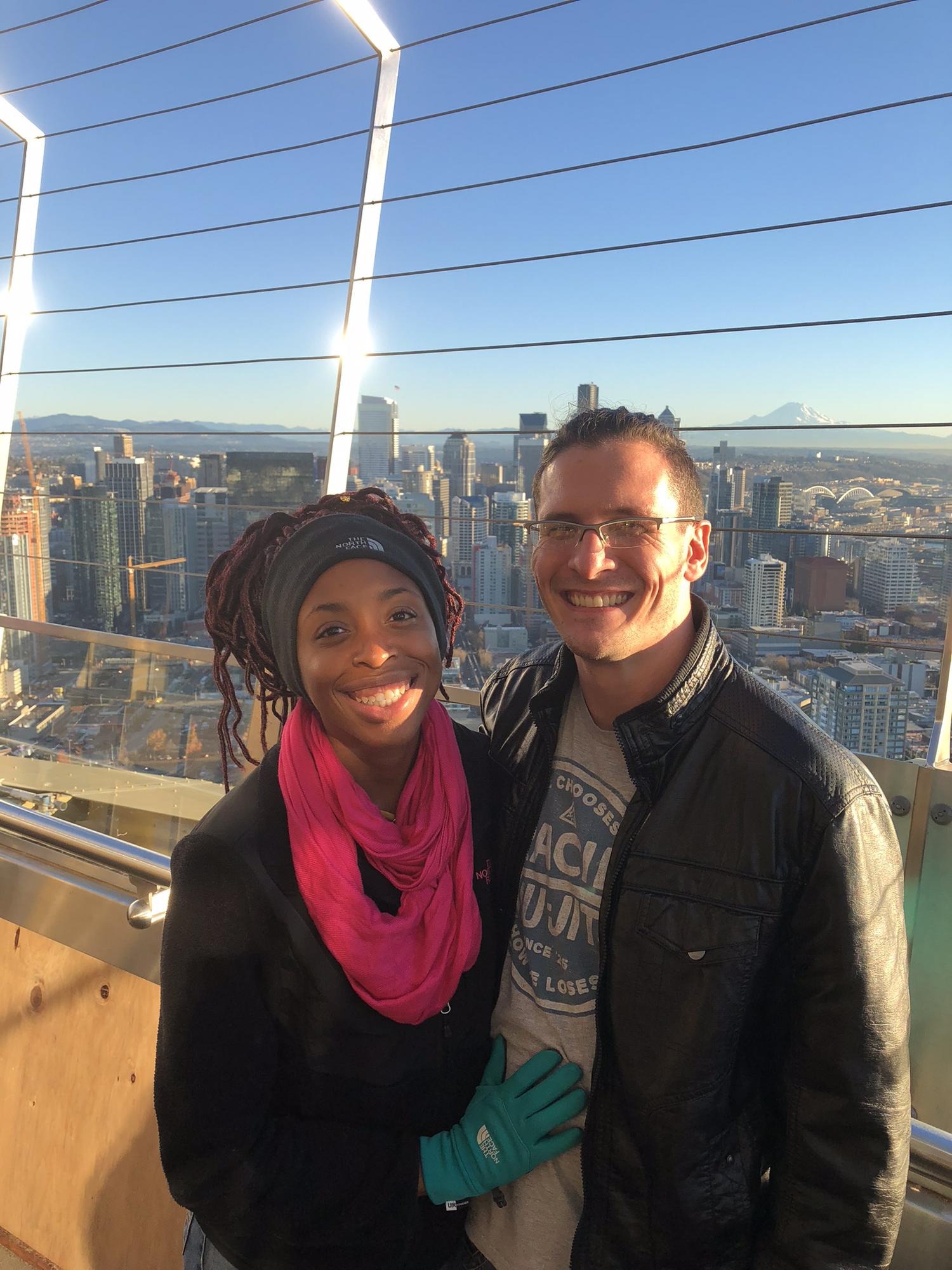 Our first flight together. We DTR’d on the plane after narrowly missing our connecting flight! This is us, newly in a relationship on the Seattle Space needle