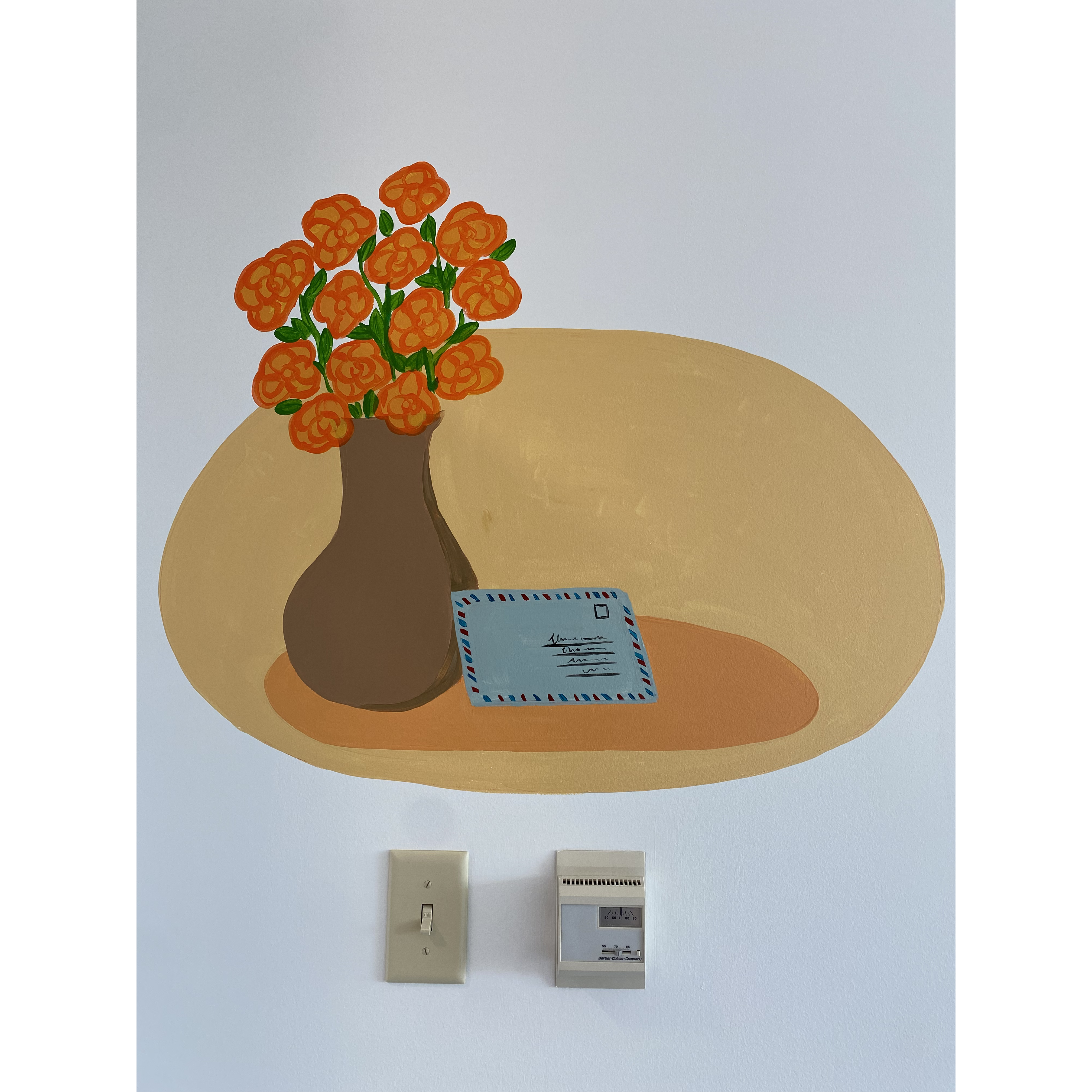 Accent: marigold in a vase with an aerogram