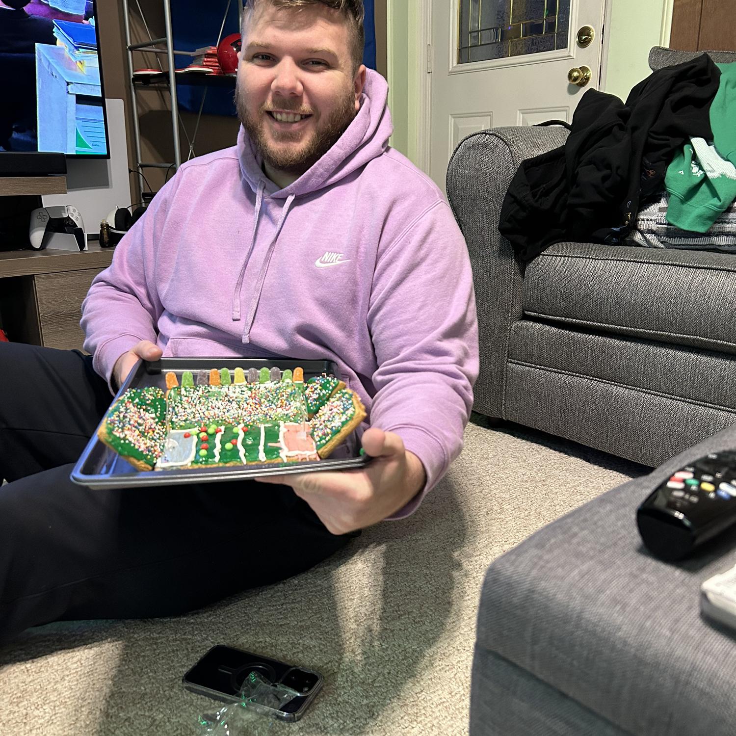 In Dec 2022, I asked Jake to make a gingerbread house with me & he said no. But he did agree to making a gingerbread football stadium! Our Christmas tradition of non-traditional gingerbread "houses"!