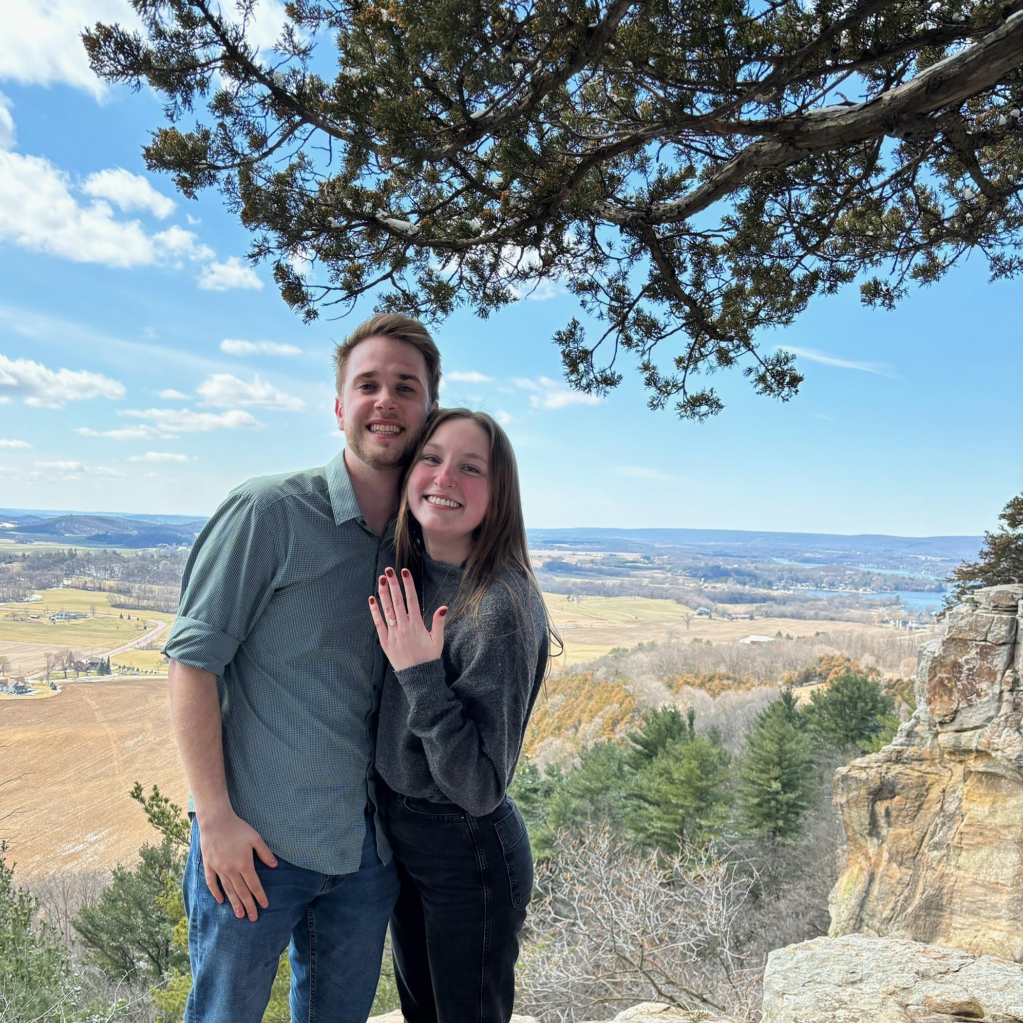 Someone hiking by saw David propose and offered to take our picture!!