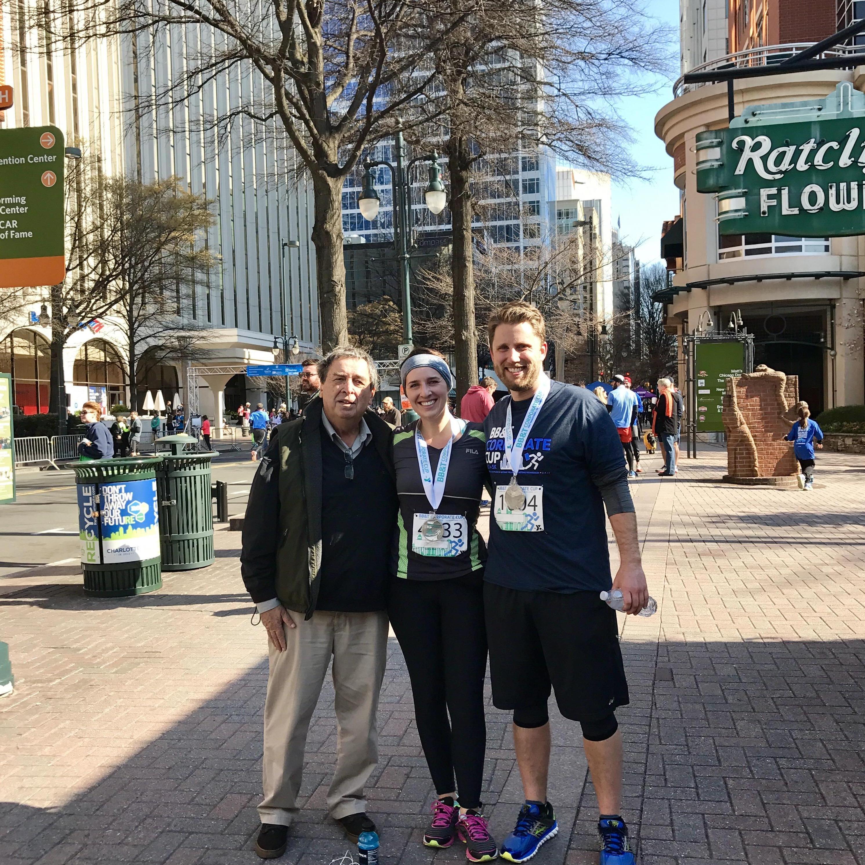 Celebrating at the half marathon finish line with Julie's dad:)
