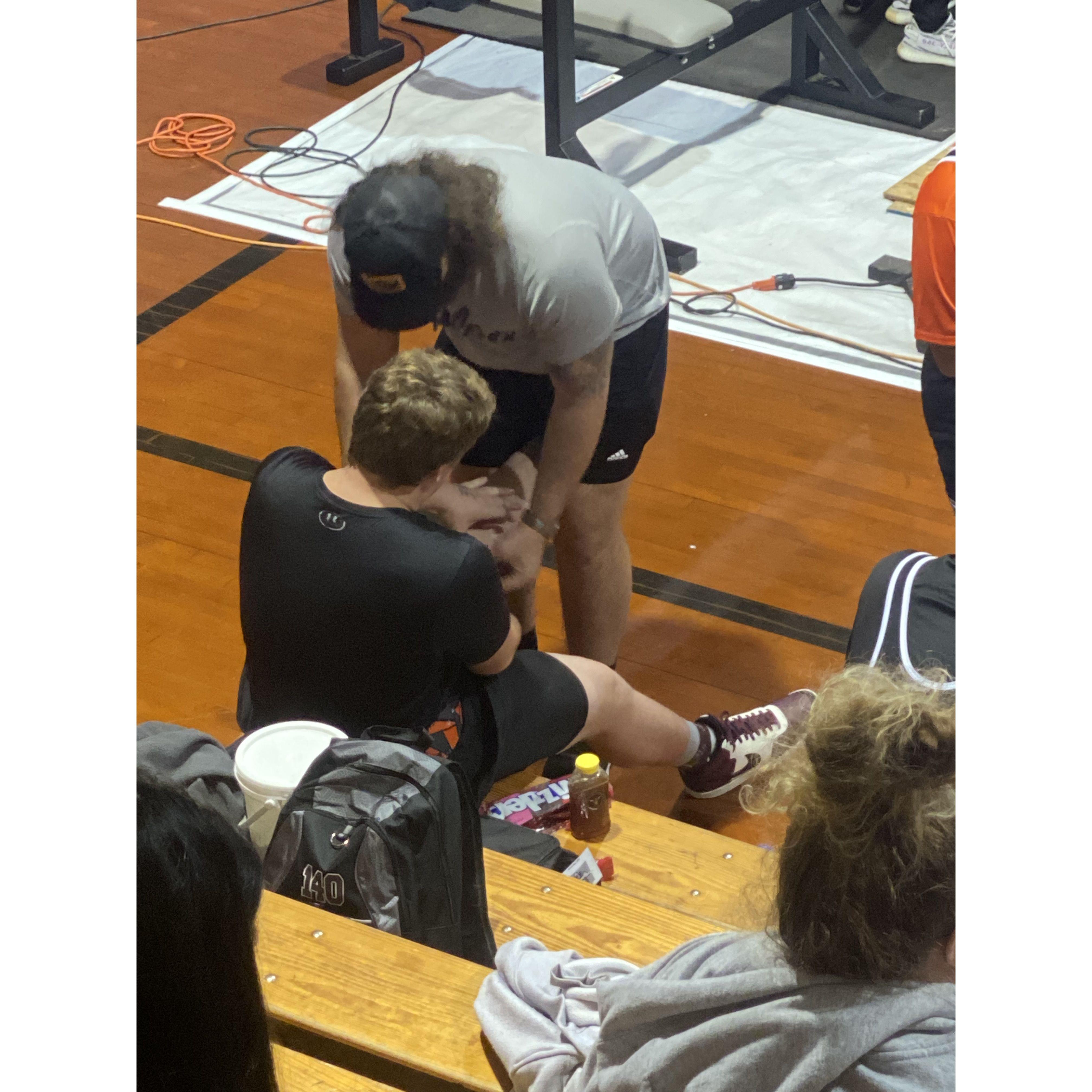 Carter helping wrap Jackson’s (Lexi’s brother) knees for his powerlifting meet. Such a special moment!!