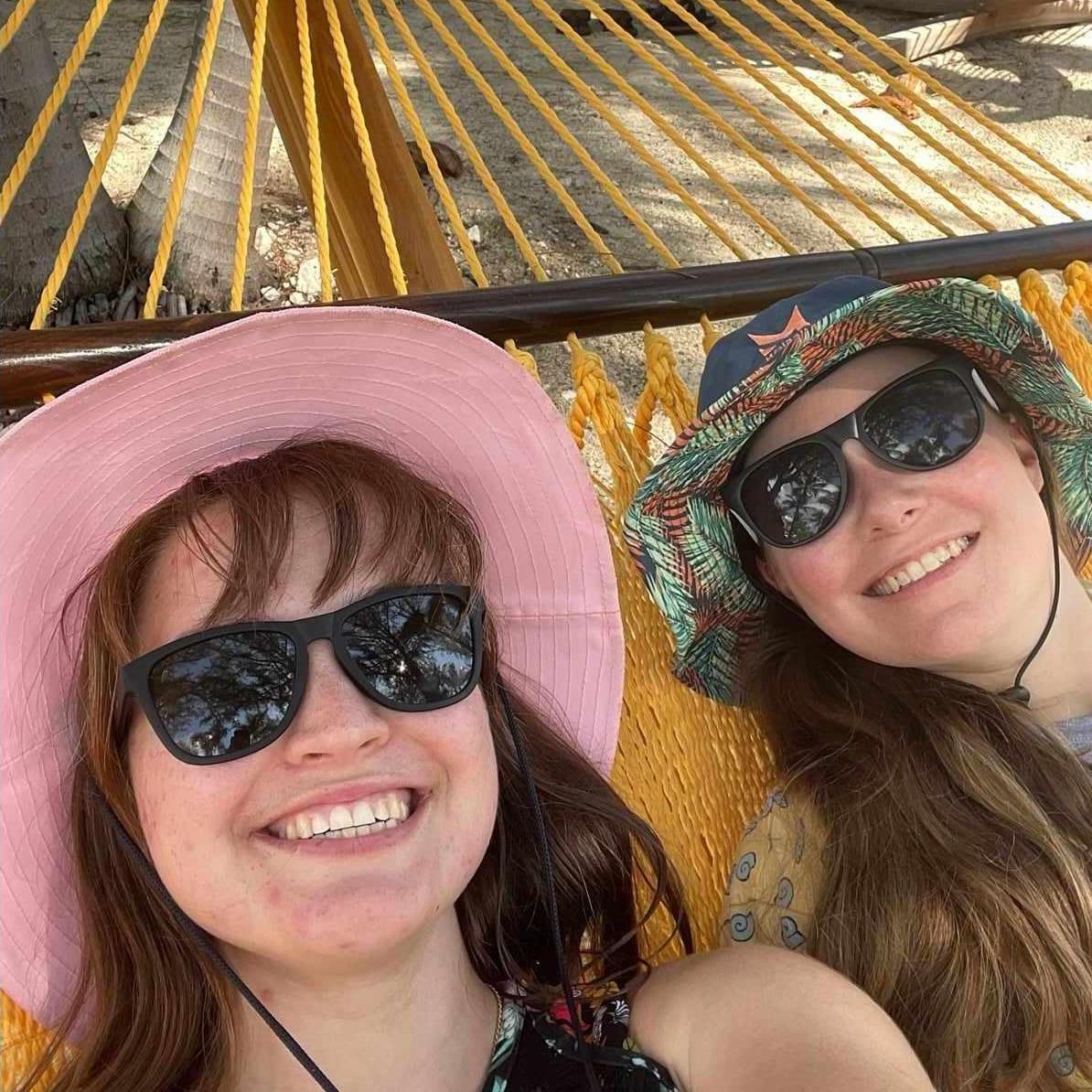 Chillin' out, maxin', relaxin', all cool, swinging in a hammock outside the pool