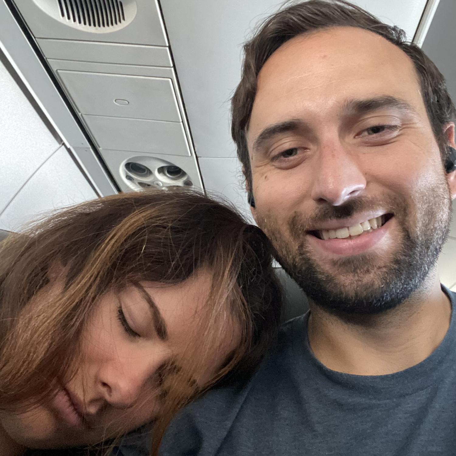 Kaley sleeps on Joey on a plane per usual - Joey in the middle seat of course