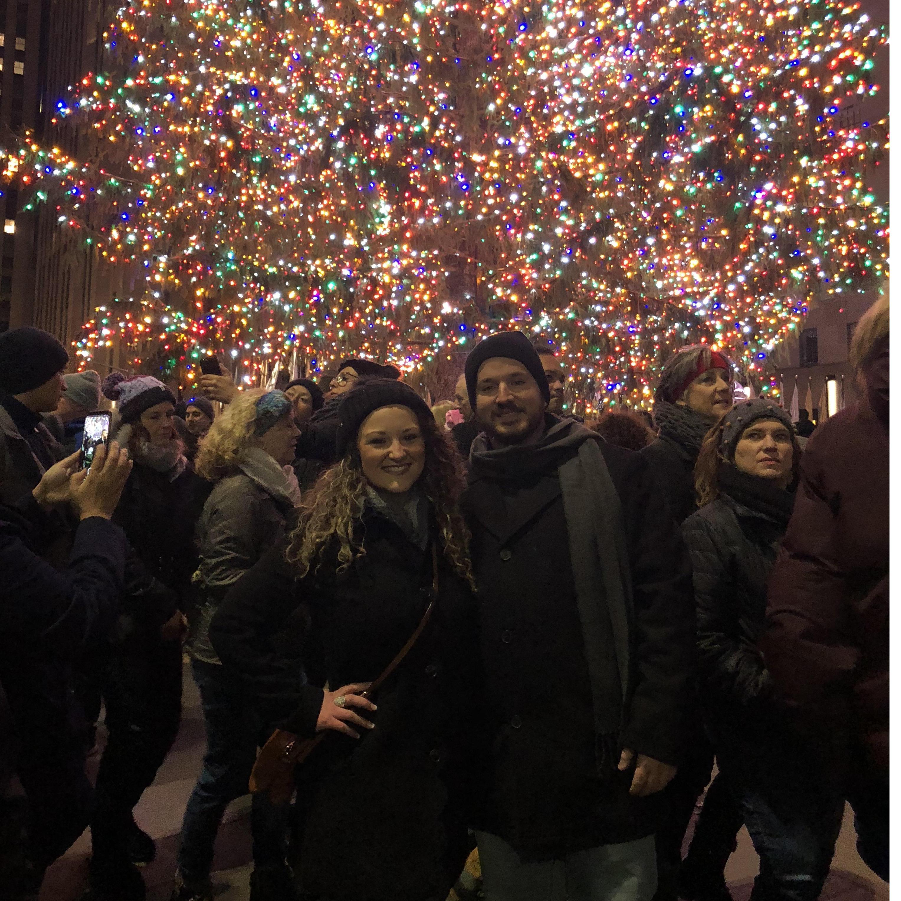 Right before Matt proposed we were getting a picture in front of the tree, just then a lady asked me for a picture of her and her man since they just got engaged! Next thing I knew, we were engaged!