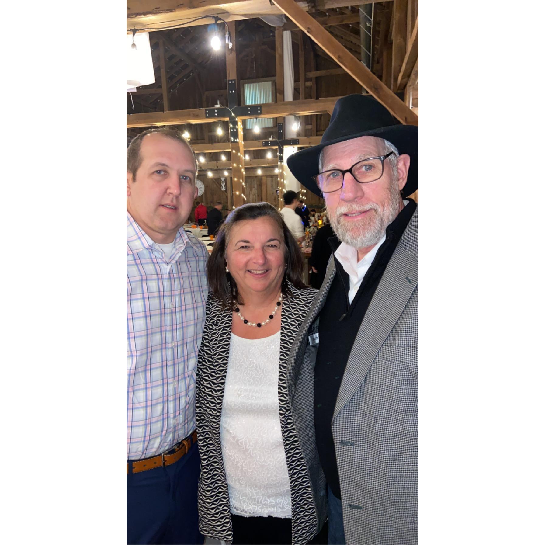 Joe with Katie’s parents at a wedding.