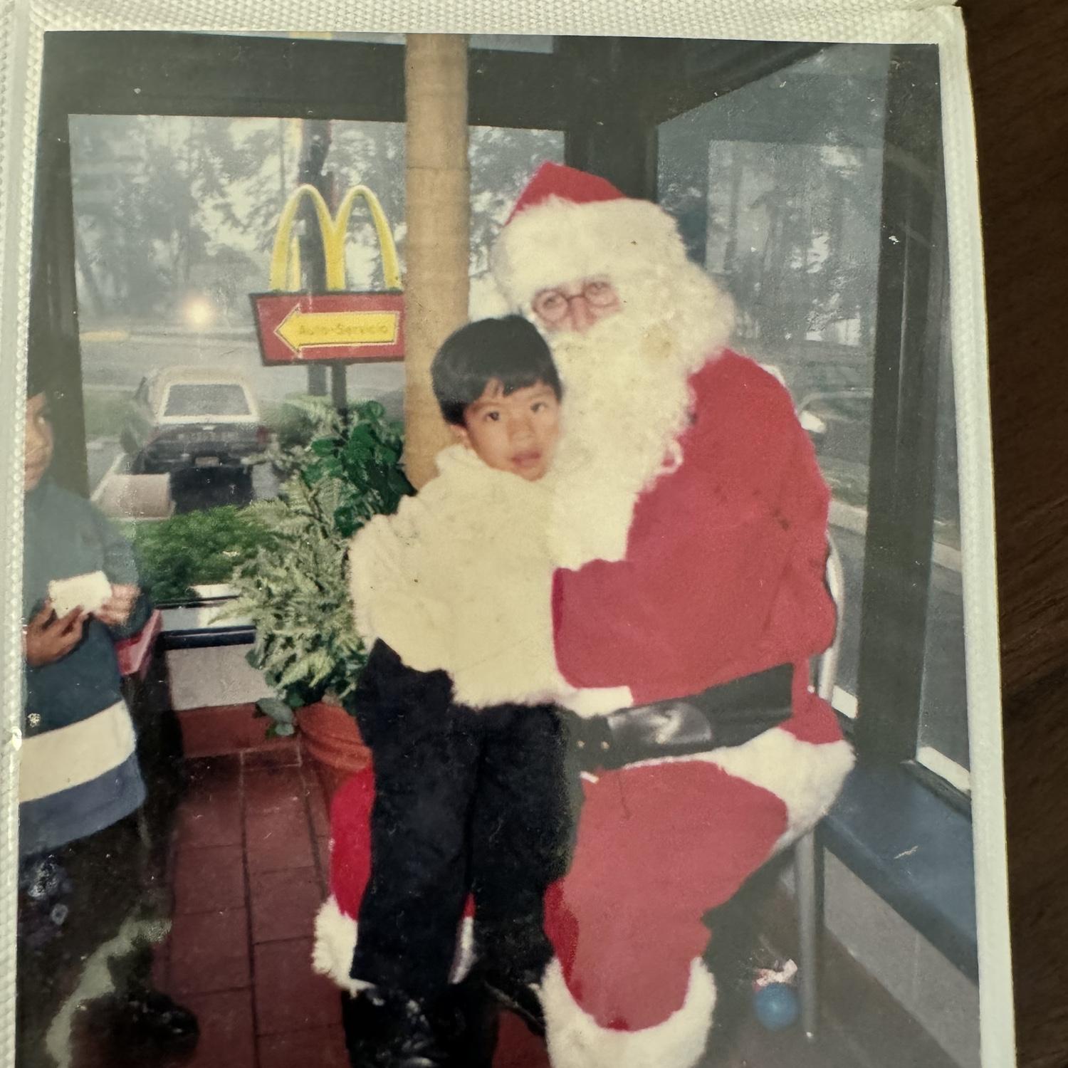 Sam getting comfy with Santa while the brother is still figuring out if he’s real…fr