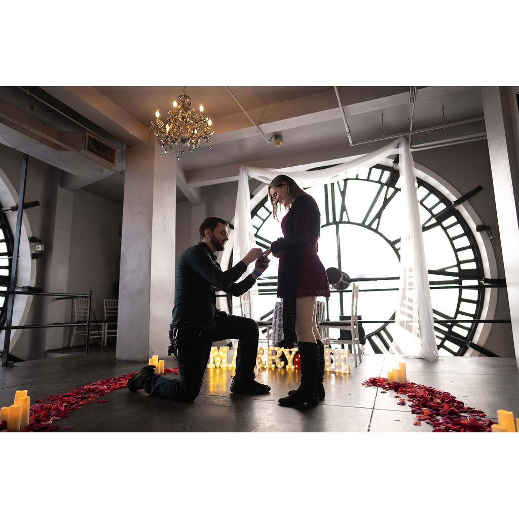 December 23, 2023: Tim proposed to Alex at the D&F Tower, with candles, rose petals, and "MARRY ME" glowing as Adore You played. She said yes, ending the night with a romantic dinner.
