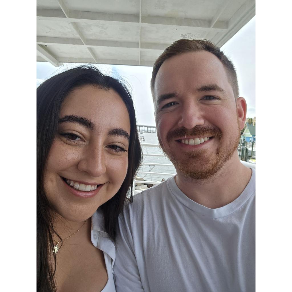 This is us the day after Eric proposed. We were on a dolphin tour and Eric was seasick.