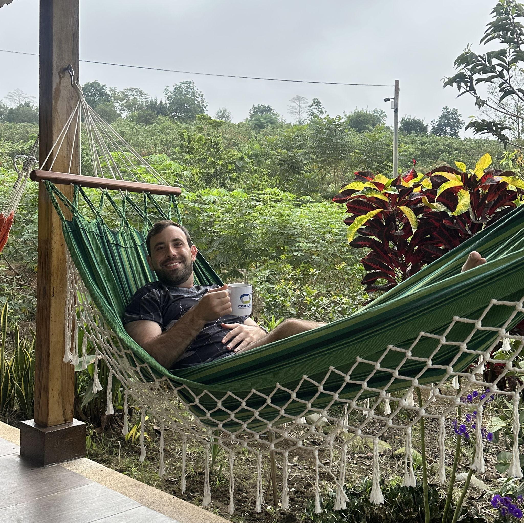 Mindo - Michael relaxing at Vanessa’s parents’ finca, surrounded by cacao trees and the sweet smell of nature. It’s the perfect place to unwind, and even better when you get to make your own chocolate