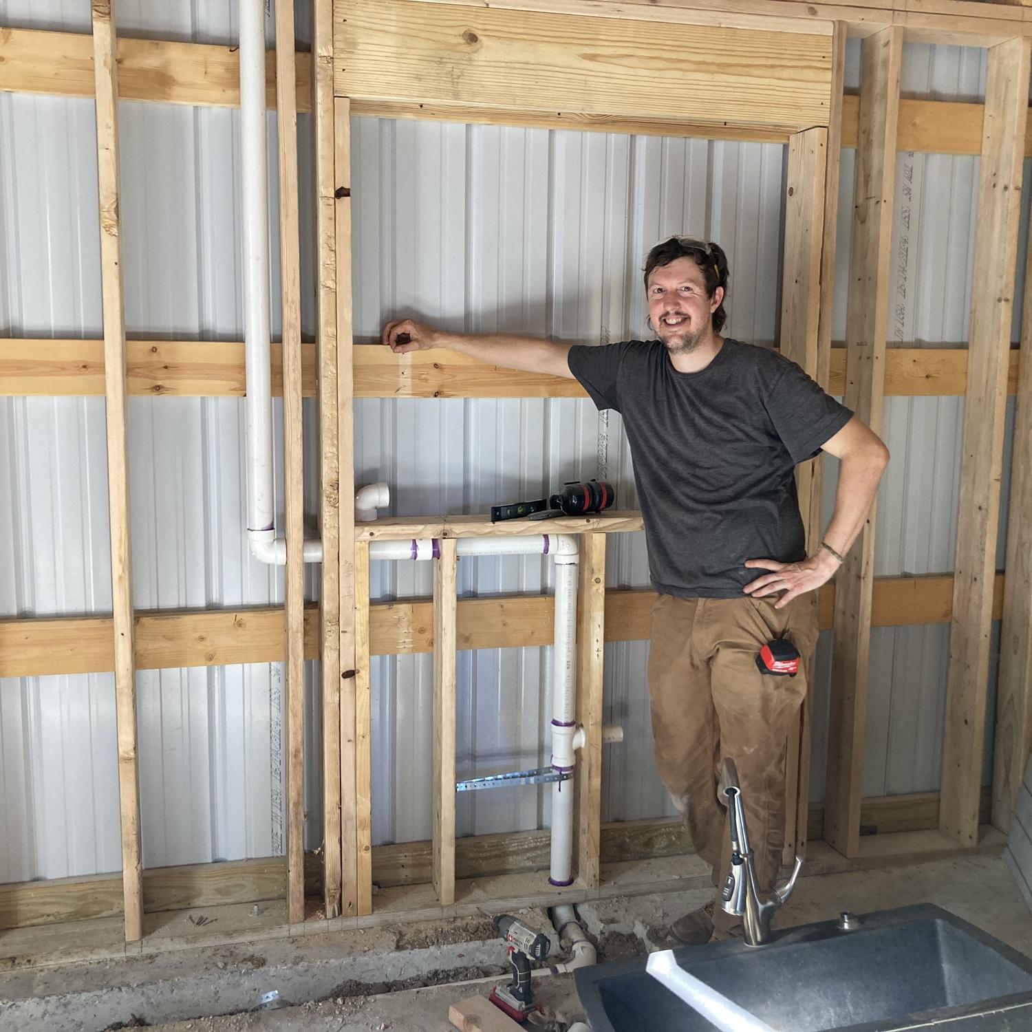 Plumbing, framing out windows! A glimpse of a house