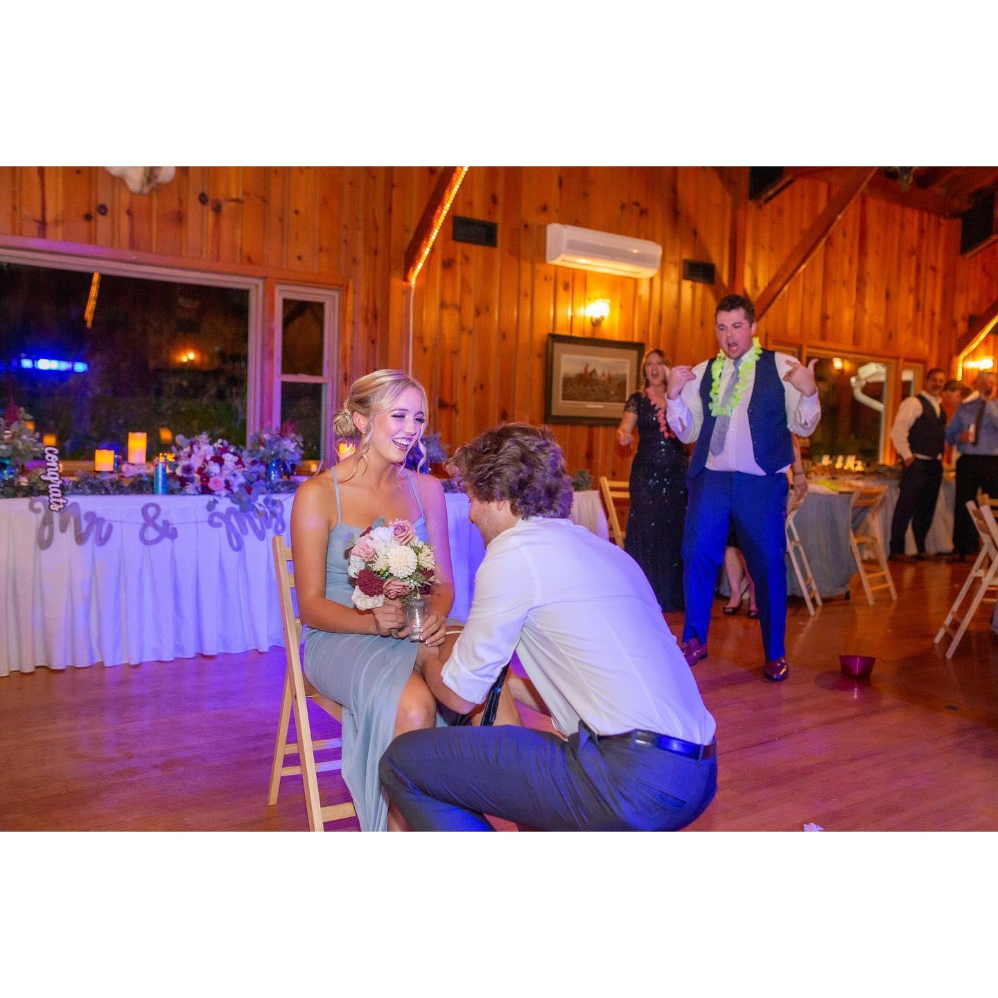 Catching the boquet and garter at our best friends wedding in 2022! Danielle was ready to be next and waiting on Jake to finish school and get a ring!
