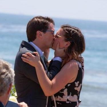 Emily stops laughing during the kiss.