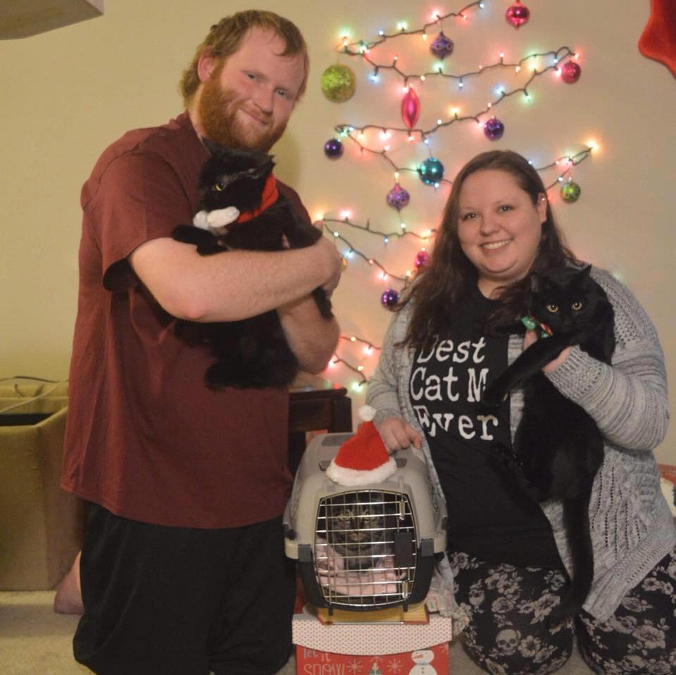 Us and our fur-babies Grim, Luna and Roxy in the kennel because she does not liked to be held :) Christmas 2018