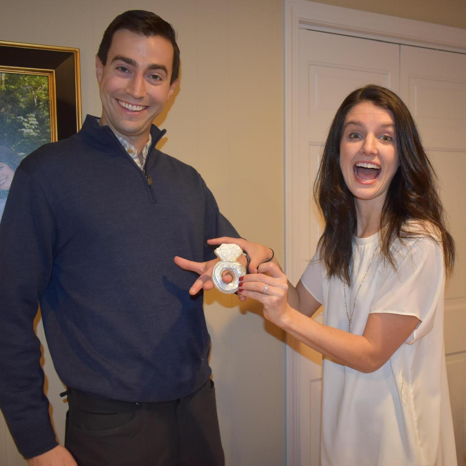 Ryan saying "I do" over a cookie ring!