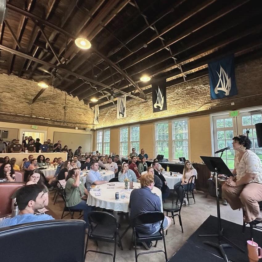 This is the night we met. Isaac is at the middle table with his back to the camera and I am at the table to the right.