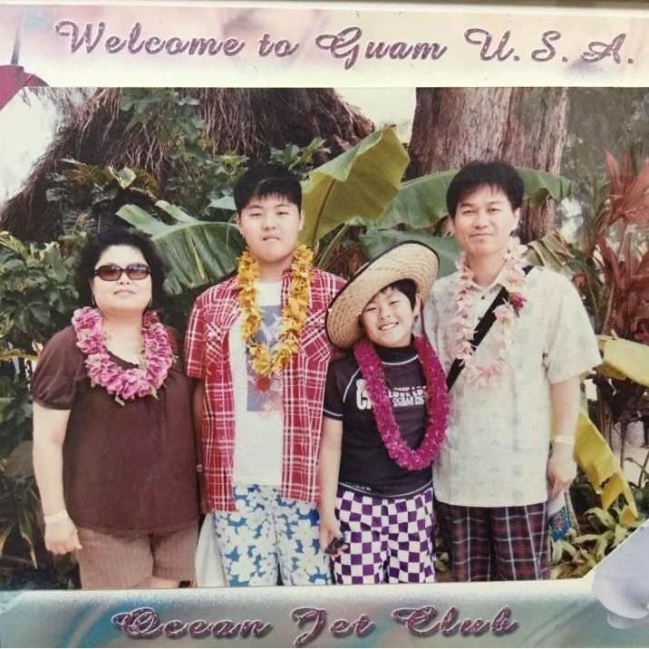 Yong with his family: It's a family trip to Guam and his first trip to the US. He forgot how to smile naturally. (Guam)